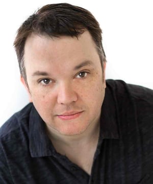 Photo of Eric Millegan, click to book