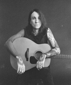Photo of Laura Jane Grace, click to book